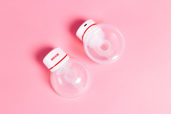 Two reggie baby wearable breast pumps - back view of one and front view of the other.